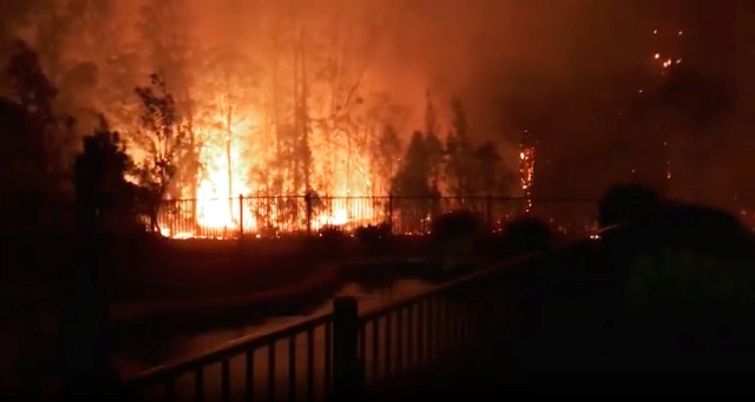 image Two dead, dozens of homes destroyed as bushfires rage across eastern Australia