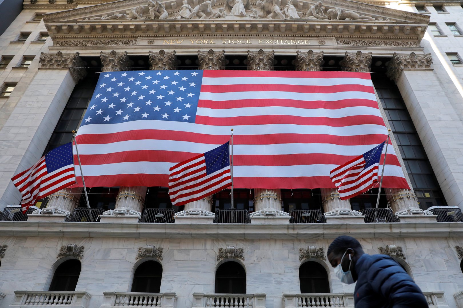 image Wall Street at a crossroads as record highs face growing risks