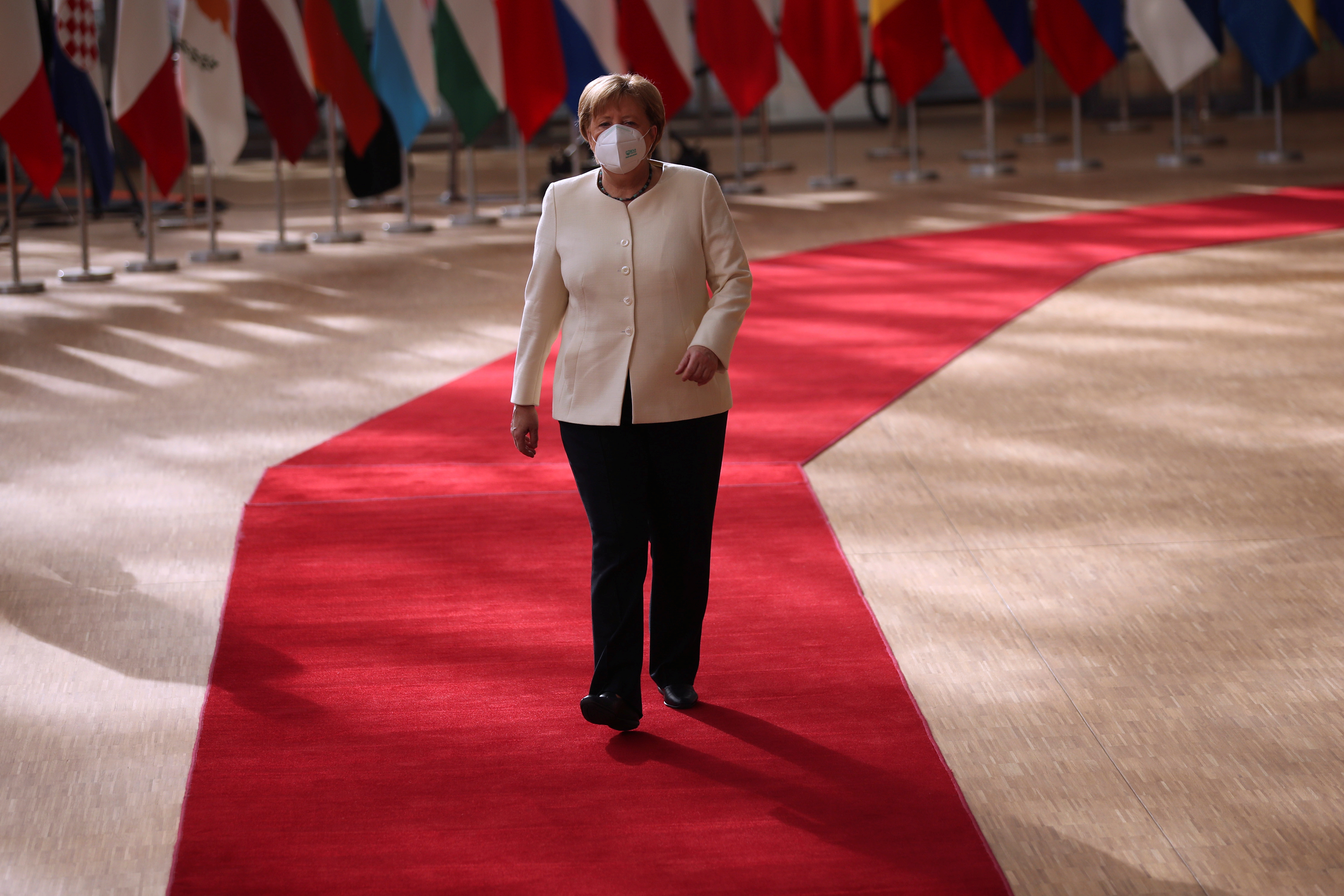 image Pandemic will not end until world is vaccinated, Merkel says