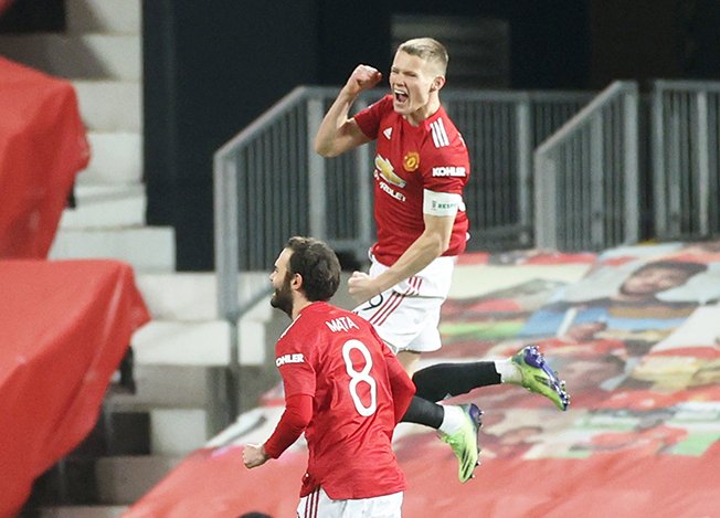 image Man United and Arsenal through in FA Cup