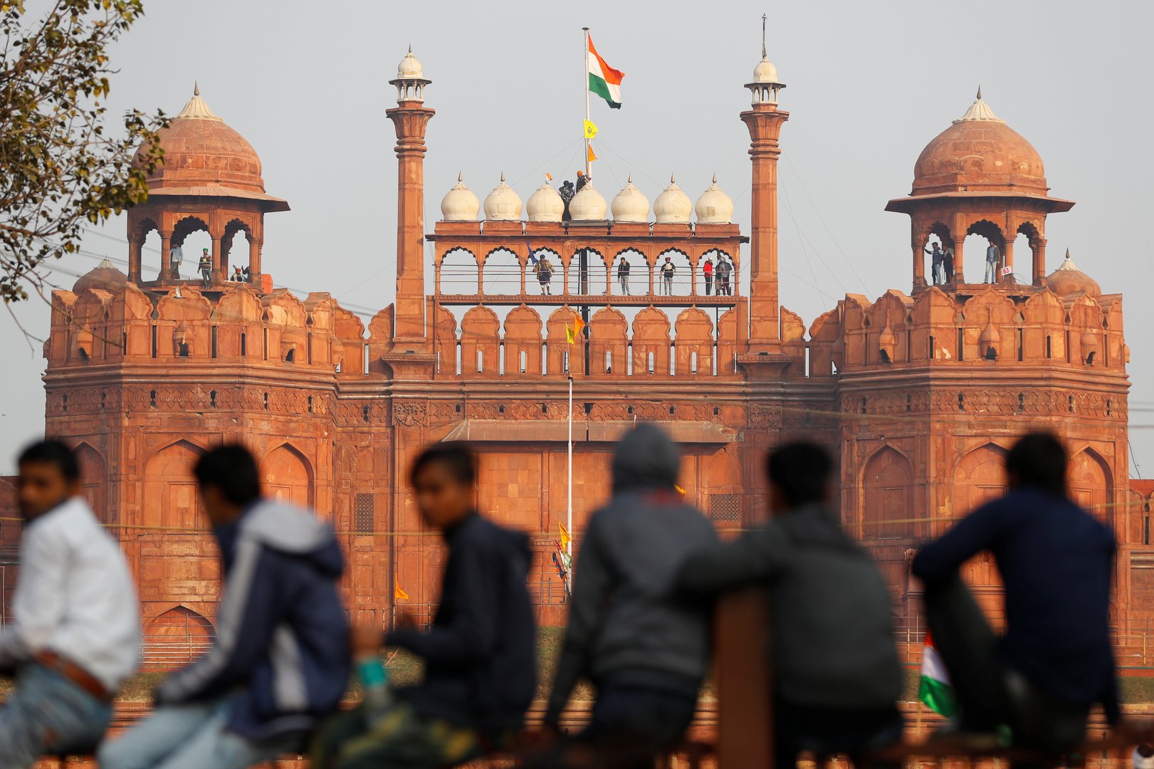 image Indian farm protesters battle police to plant flags at historic Red Fort