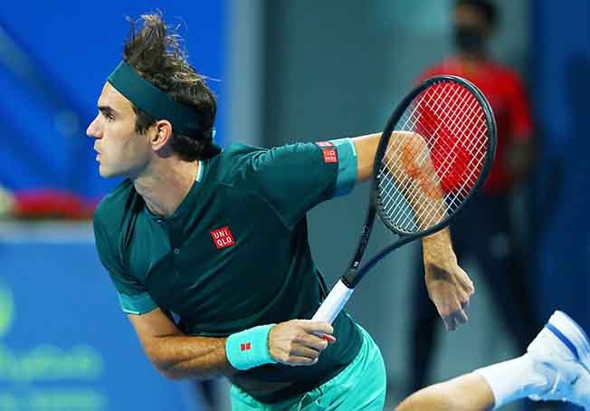 image Federer beats Evans in first match for 14 months