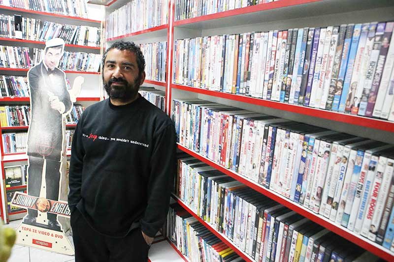 image DVD club owner hangs on to a vanishing sector