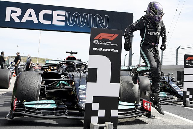 image Hamilton goes eight points clear with victory in Portugal