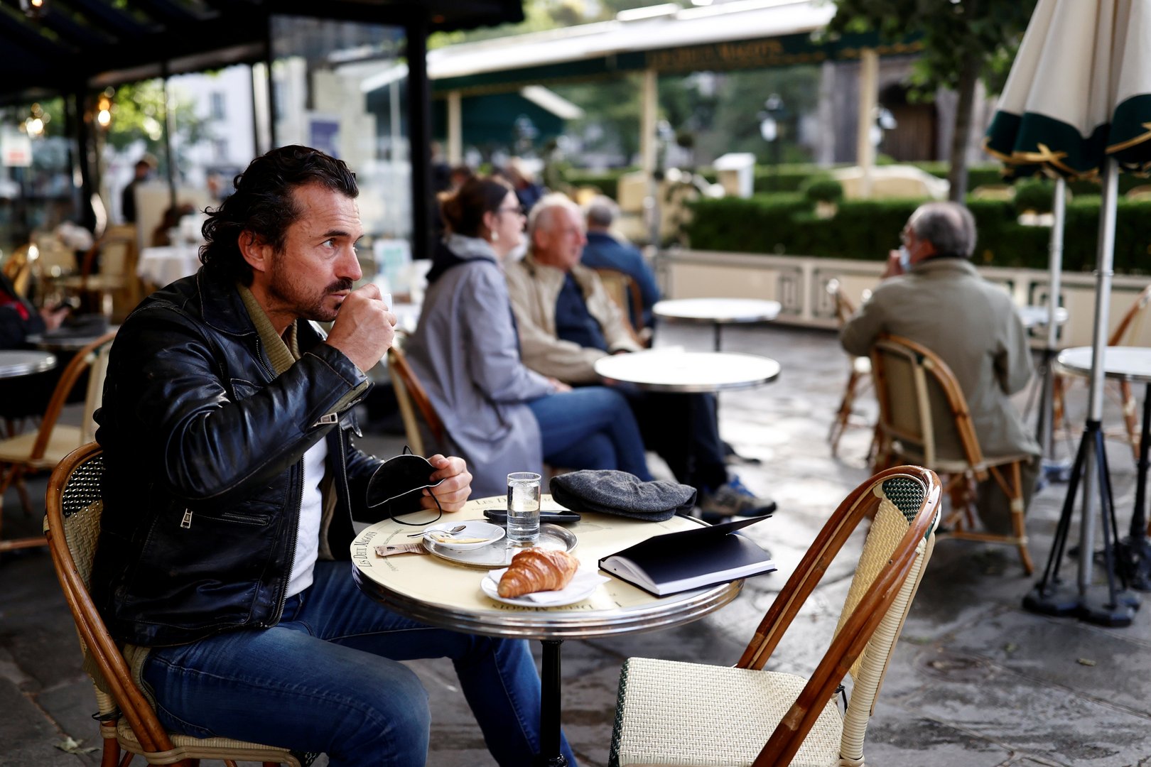 image Parisians tuck into coffee and croissants again as cafes re-open