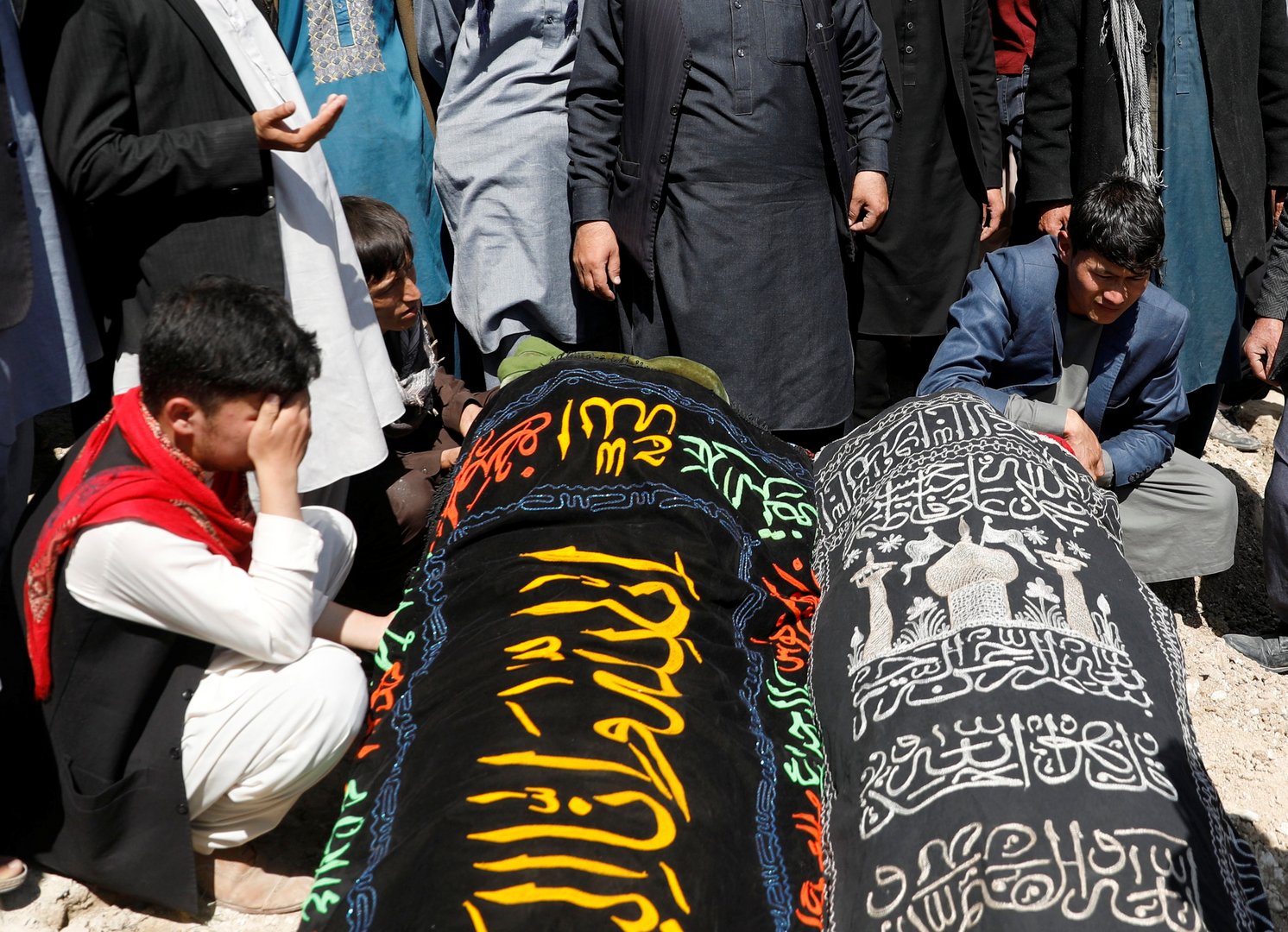 image Afghan school blast toll rises to 58, families bury victims