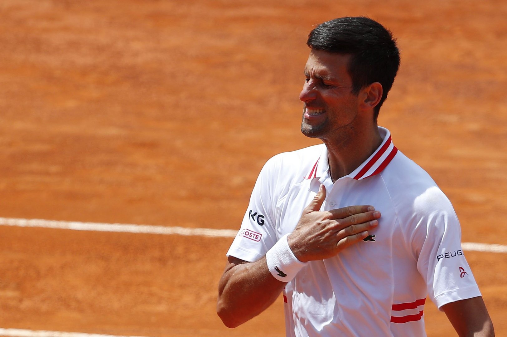 image Djokovic fights back to beat Tsitsipas at Italian Open