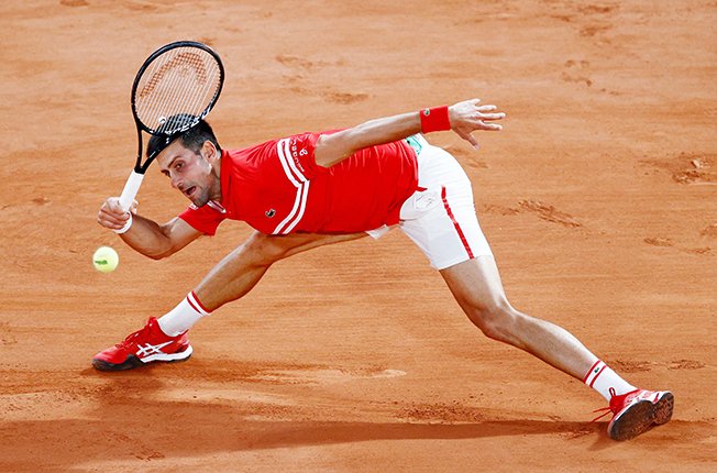 image Djokovic marches into fourth round with Berankis thrashing