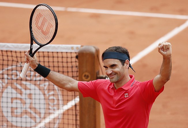 image Federer and Djokovic through at Roland Garros