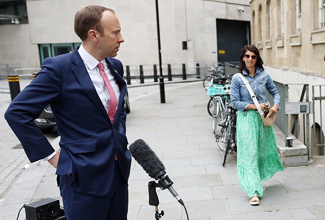 image UK health minister quits after breaking Covid rules by kissing aide