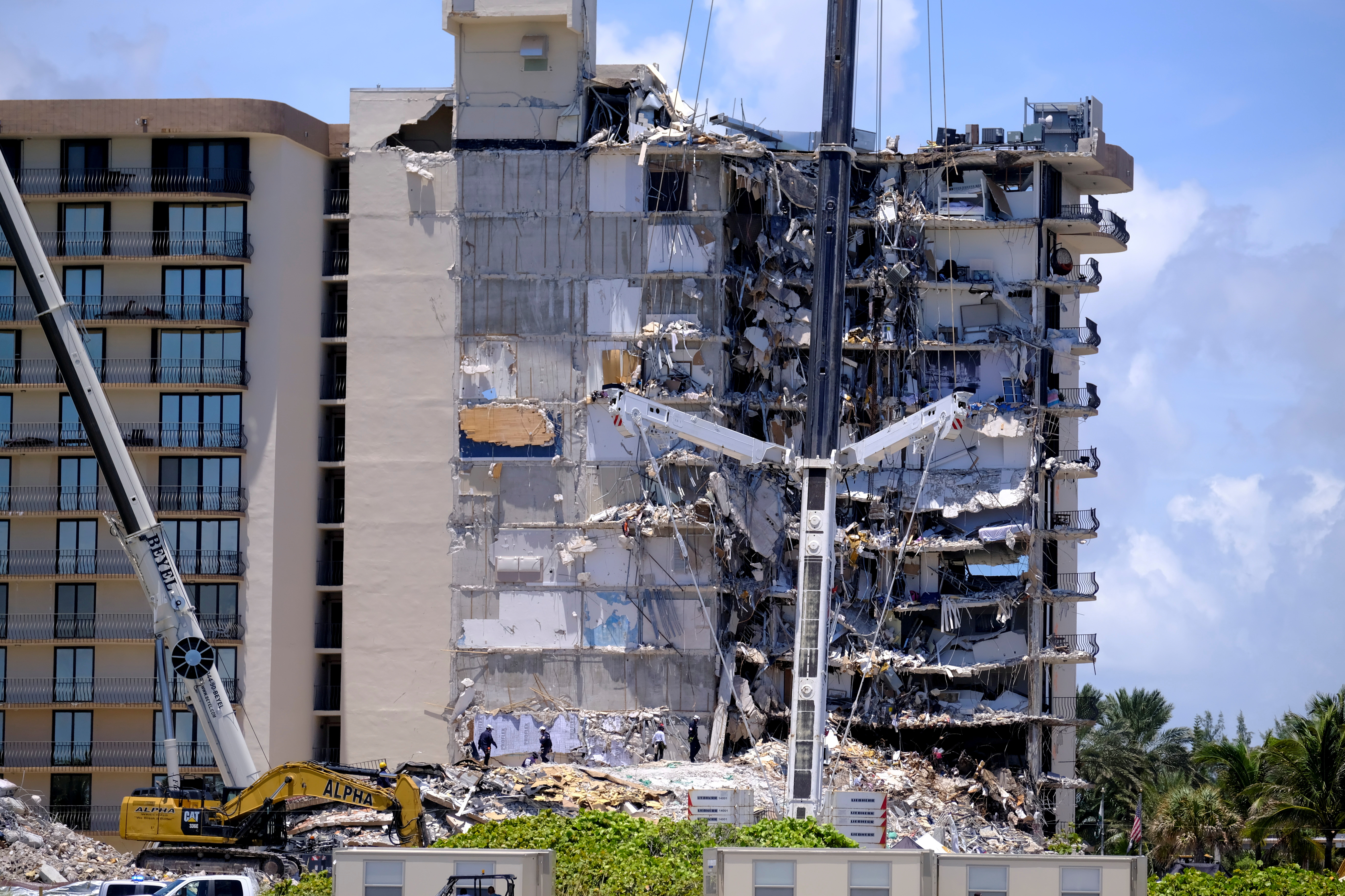image Death toll in Florida condo collapse climbs to 9, with 150 still missing