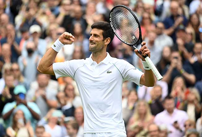 image Clinical Djokovic glides past Anderson into third round