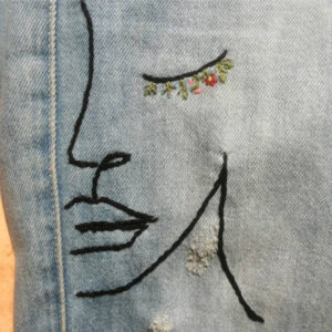one fof dorita's 'one line' series, in whcih she embroiders denim in a single line of intricate stitching