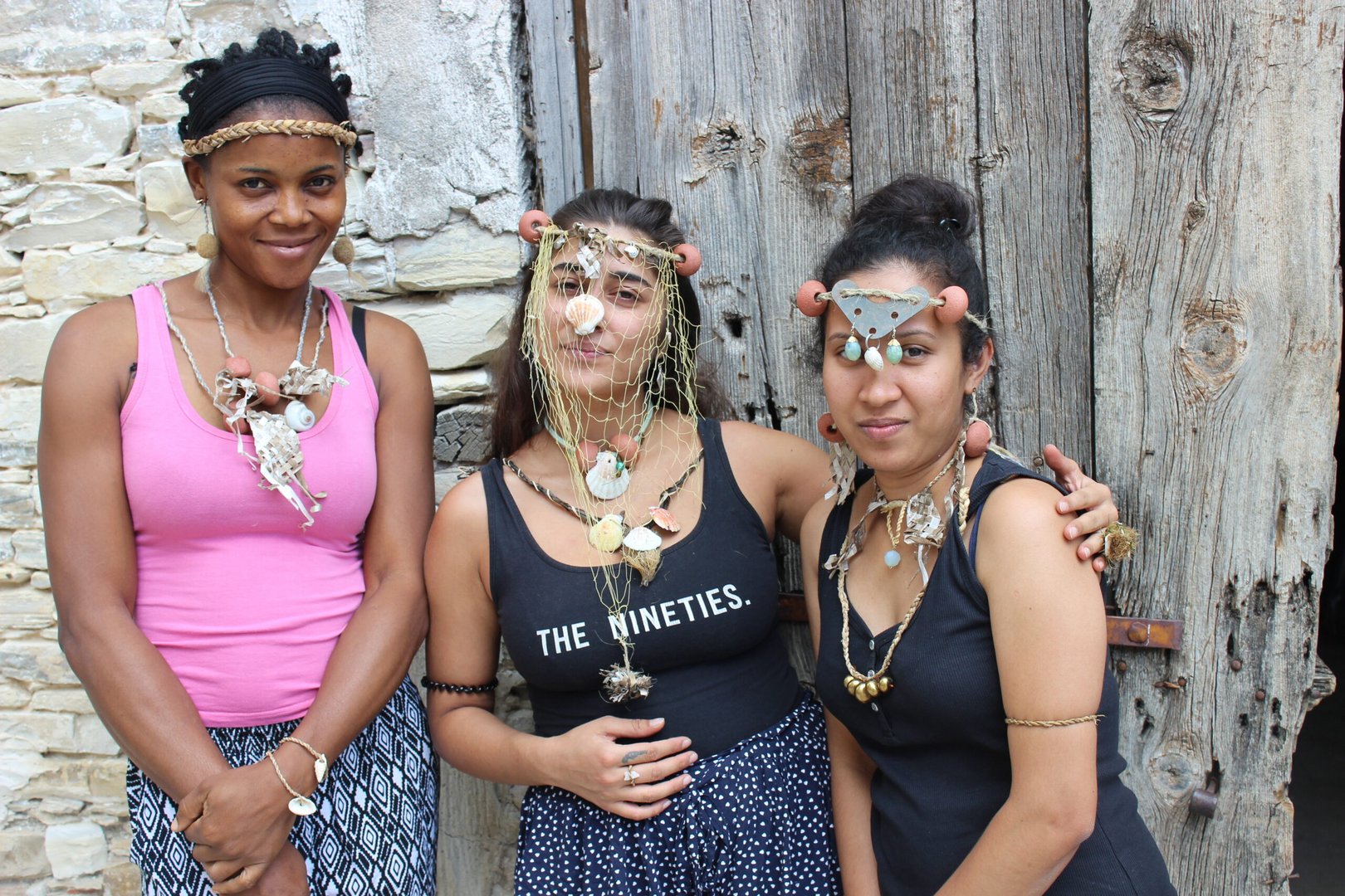 martin from left honorine, chrictiana, himashi with the jewellery they made with sea grass at a workshop image by monica oprean and jeffrey kporjro