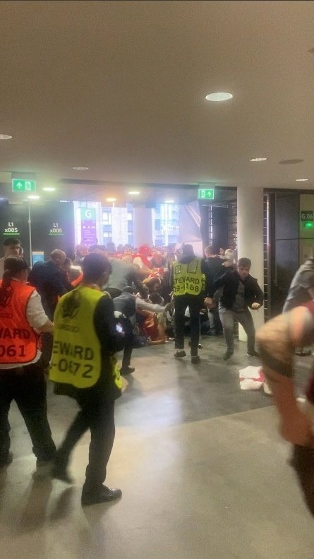 video grab shows fans attempting to get through a door meant for disabled access at wembley stadium before the euro 2020 final soccer match between italy and england, in london, britain