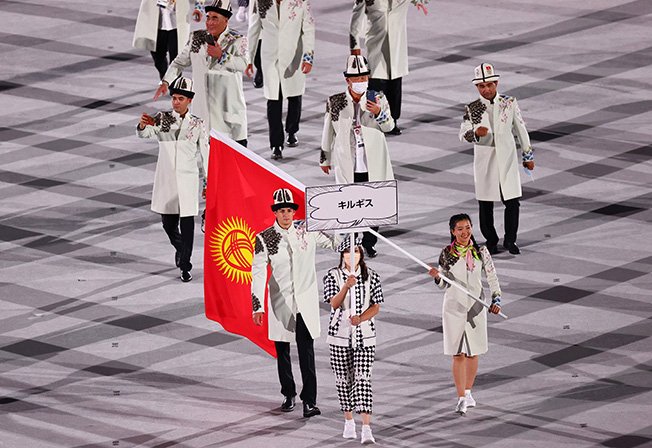image Mask-shy Kyrgyzstan, Tajikistan rain on opening parade