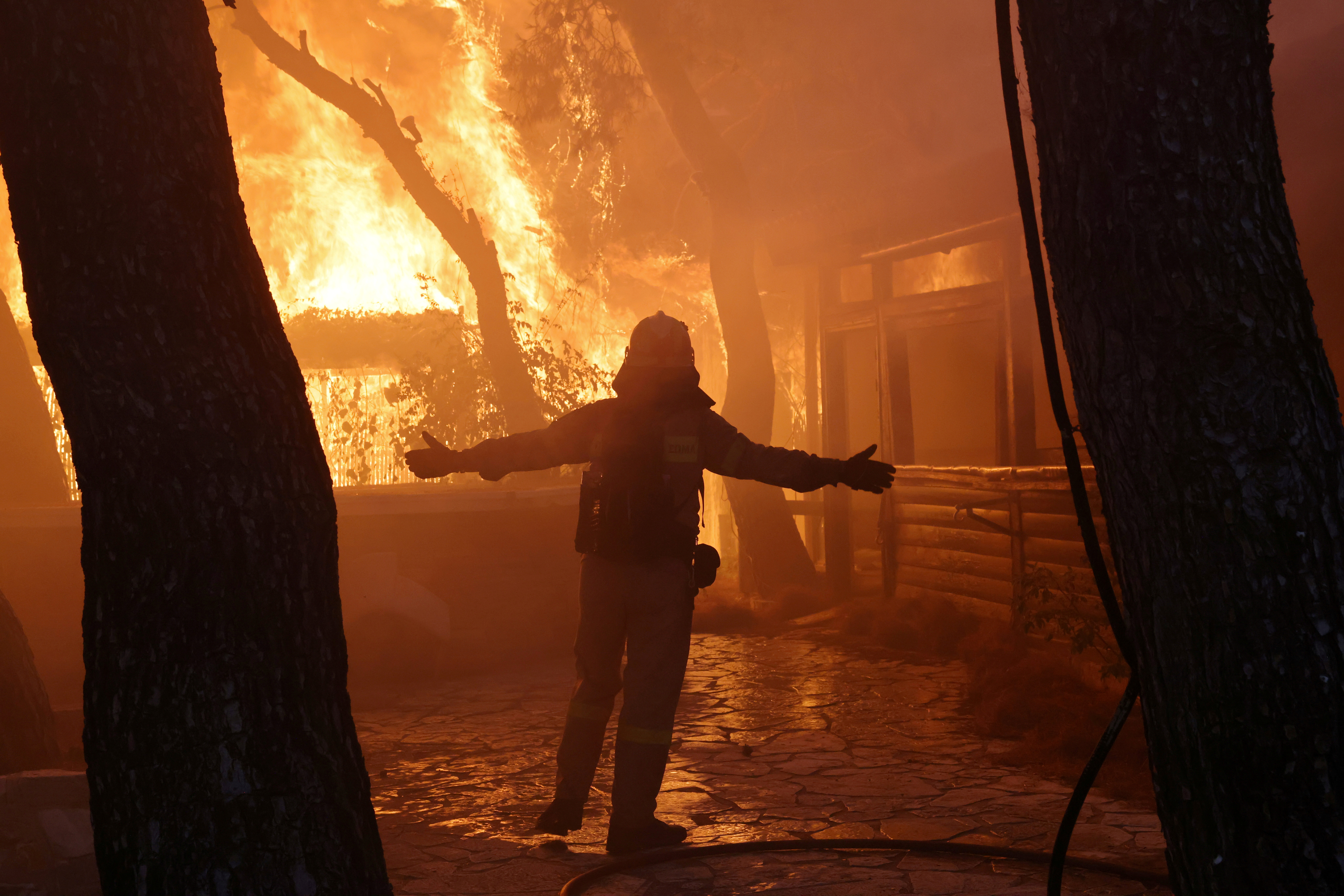 image Greece battles wildfires for third day, site of ancient Olympics saved