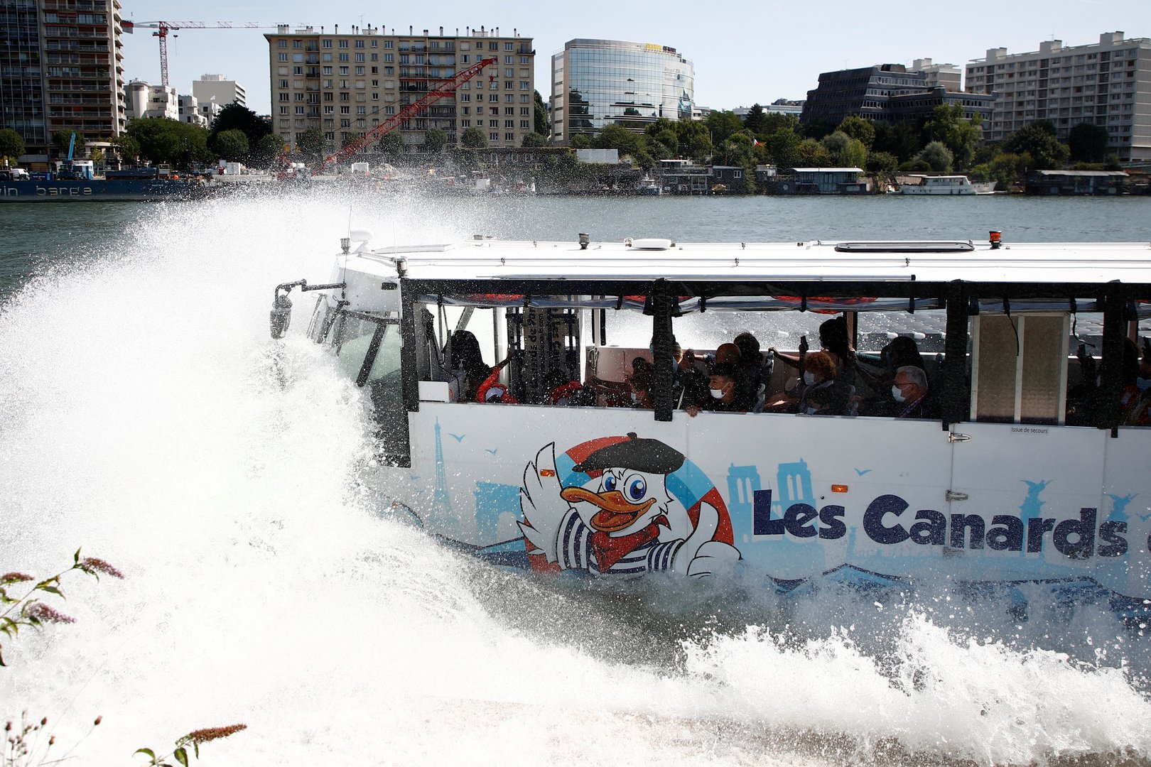 an amphibious bus splashes into the seine river in sevres near paris