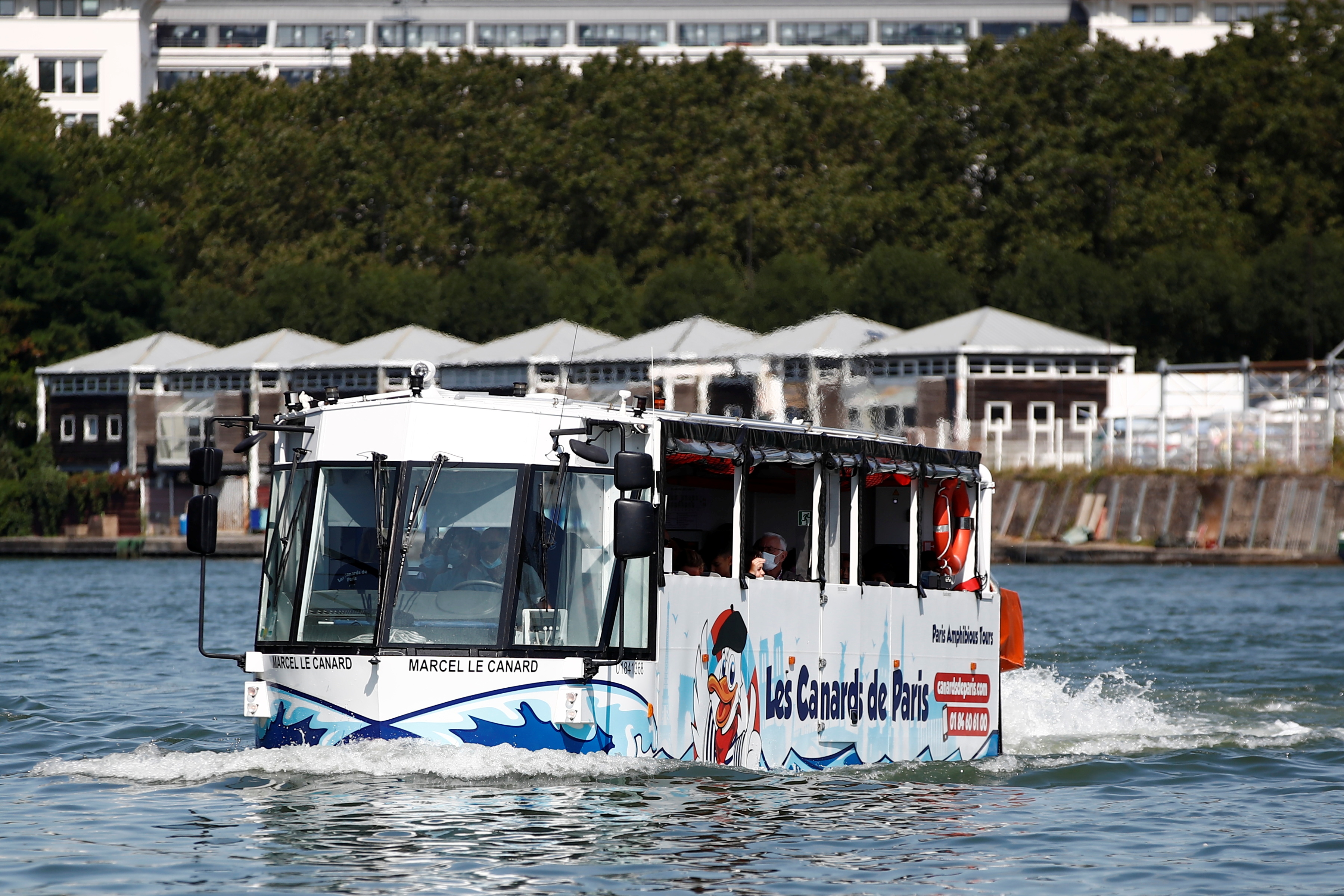 an amphibious bus sails down the seine river in sevres near paris