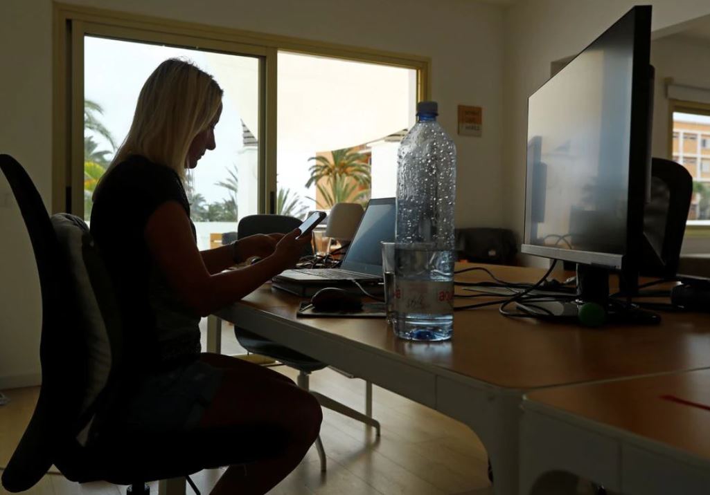 image Sun-seekers enjoy European summer &#8216;workcation&#8217; before office return
