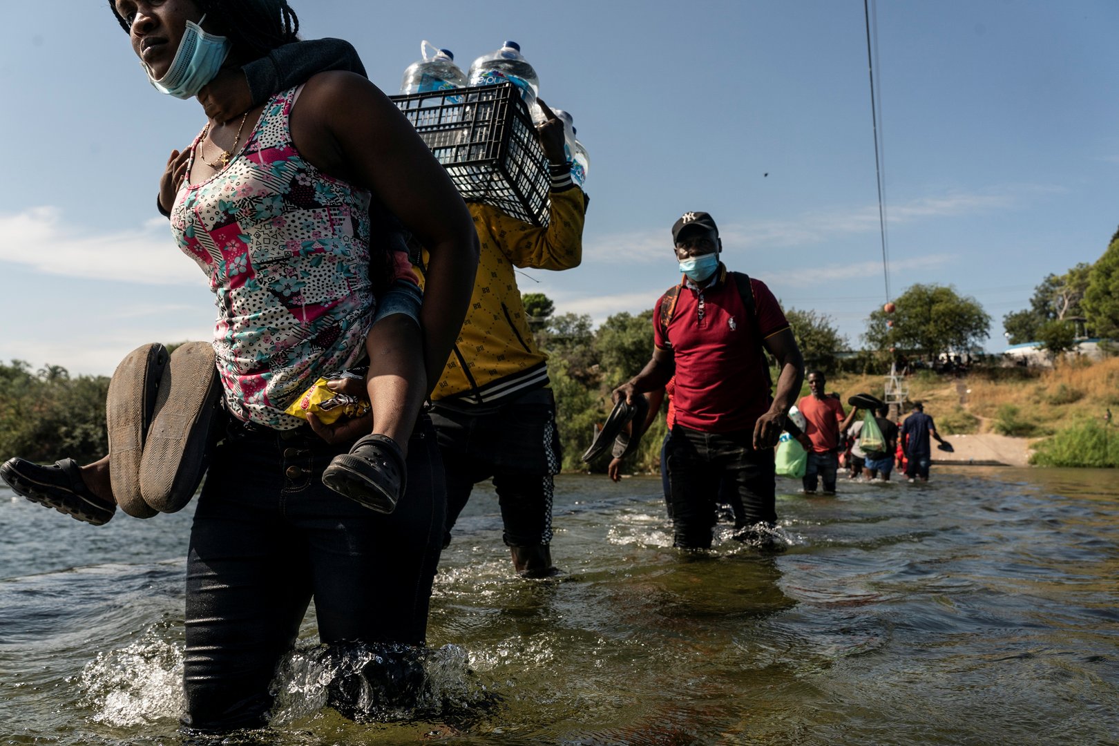 image Thousands of migrants converge under Texas bridge, posing new challenge for Biden