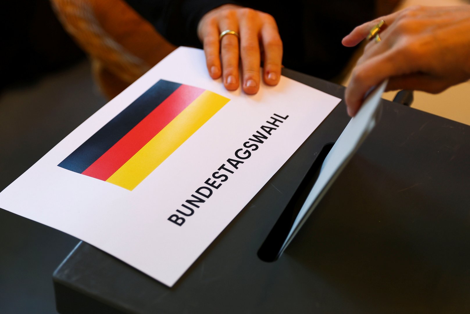 image Germans vote in close election to decide Merkel successor