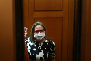 senator sinema enters an elevator before walking onto the senate floor on capitol hill in washington
