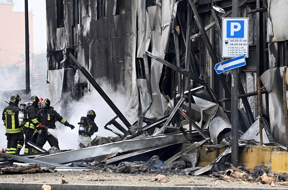 image Small plane crashes into empty building outside Milan, all 8 onboard die