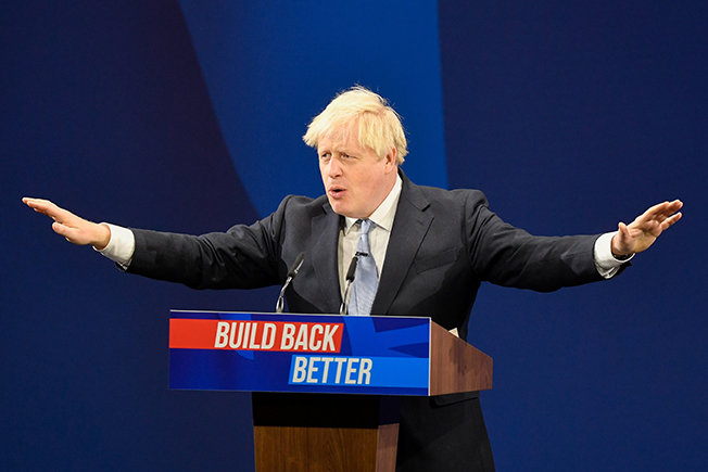 image Shrugging off crises, PM Johnson delights party, annoys business