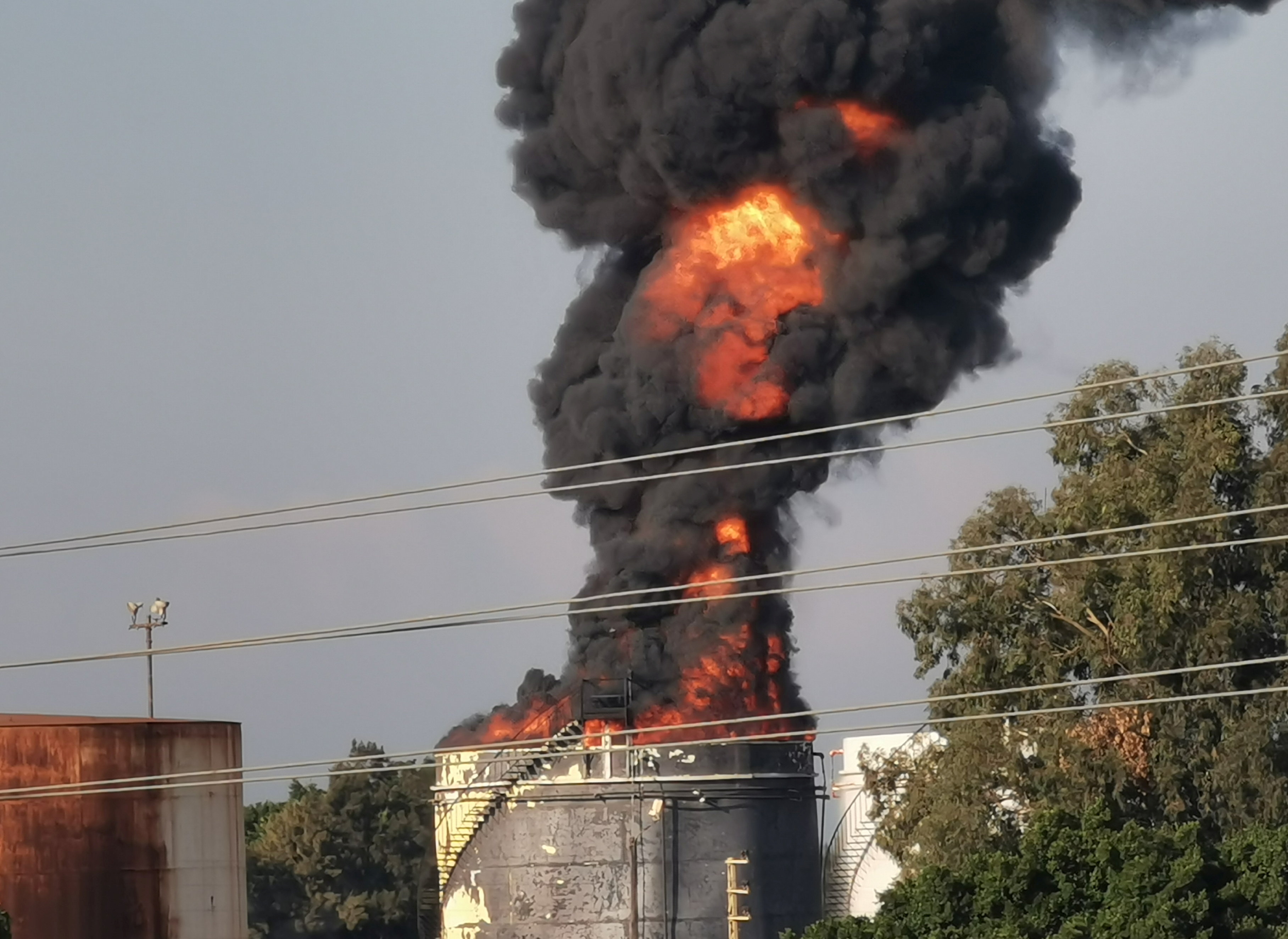 image Lebanese firefighters contain fire at fuel facility, minister says (Updated)