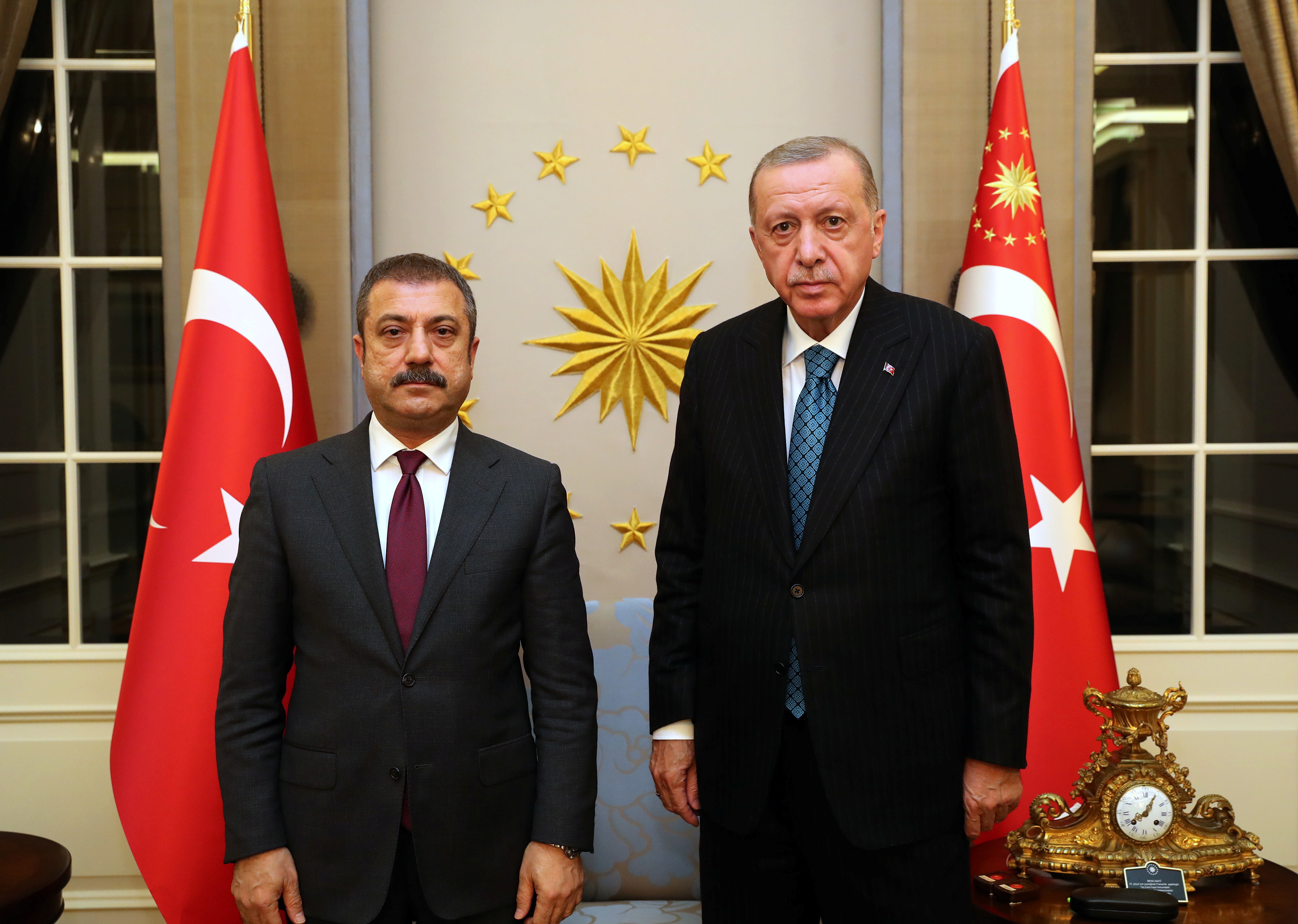 image Turkish lira hits record low, Erdogan overhauls monetary policy committee