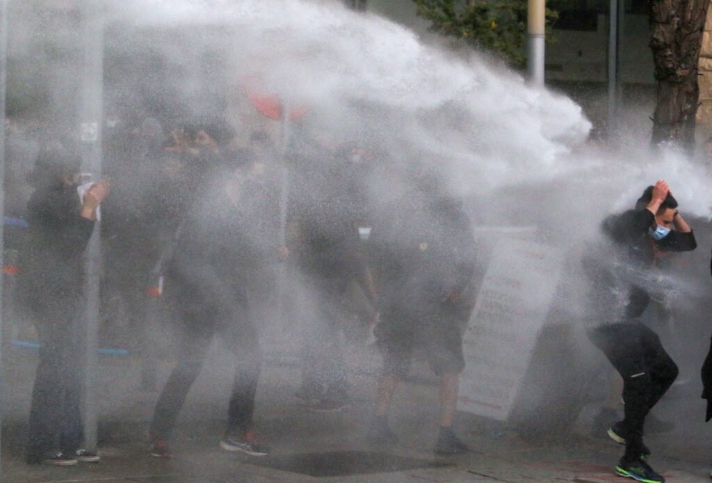 image Police watchdog recommends legal action against officers in protest crackdown