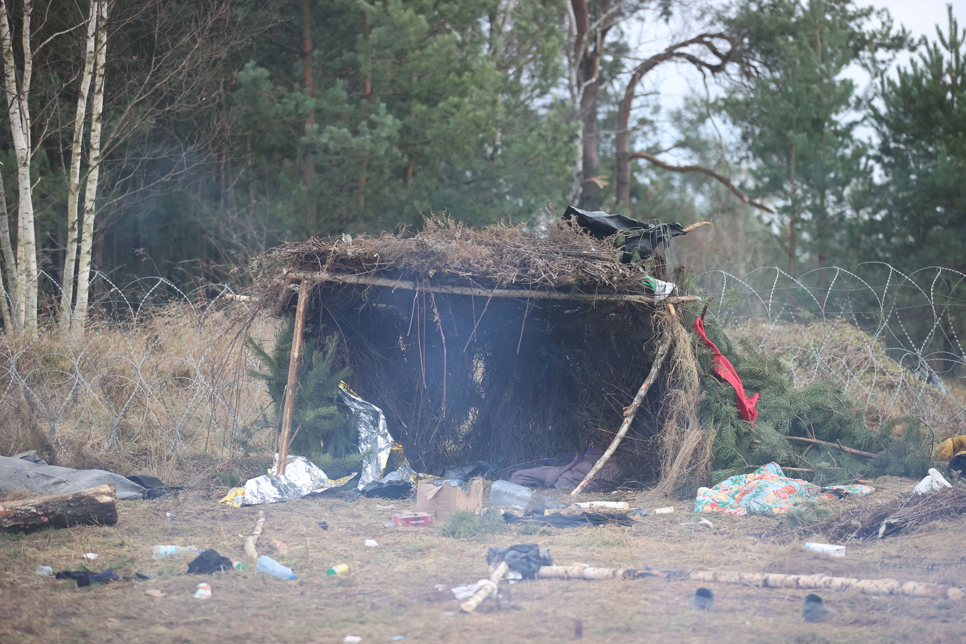 image Belarus clears migrant camp at border with EU