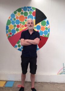 irish artist michael o' boyle with 'petrie dish' painting at cyprus college of art