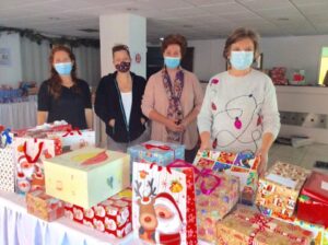 rachel clayton, sara khailis, sue petropoulakis and diane pelekanos (left to right) checking shoeboxes before distribution.