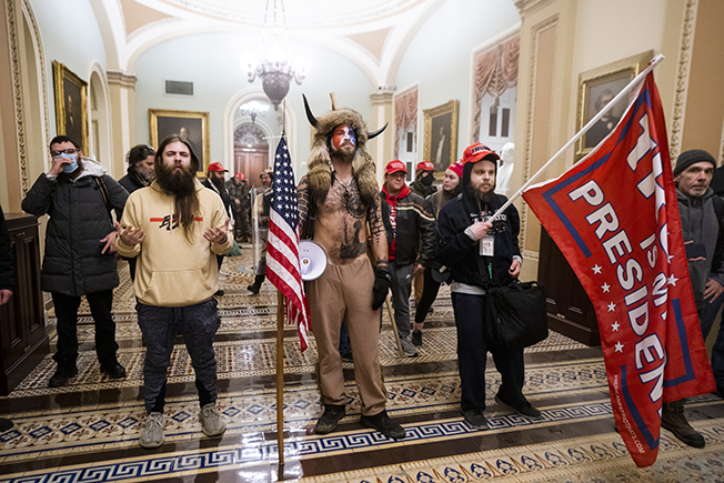 image US Capitol rioter &#8216;QAnon Shaman&#8217; sentenced to over three years in prison