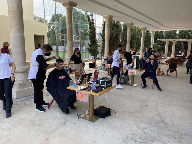 image Students have hair cut and braided for charity