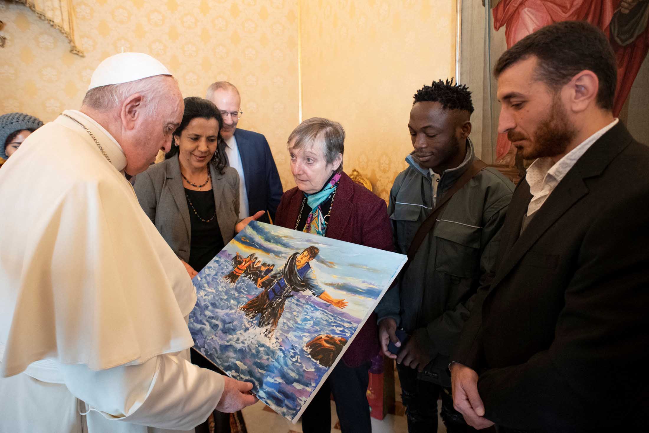 image Migrants help Pope Francis celebrate 85th birthday