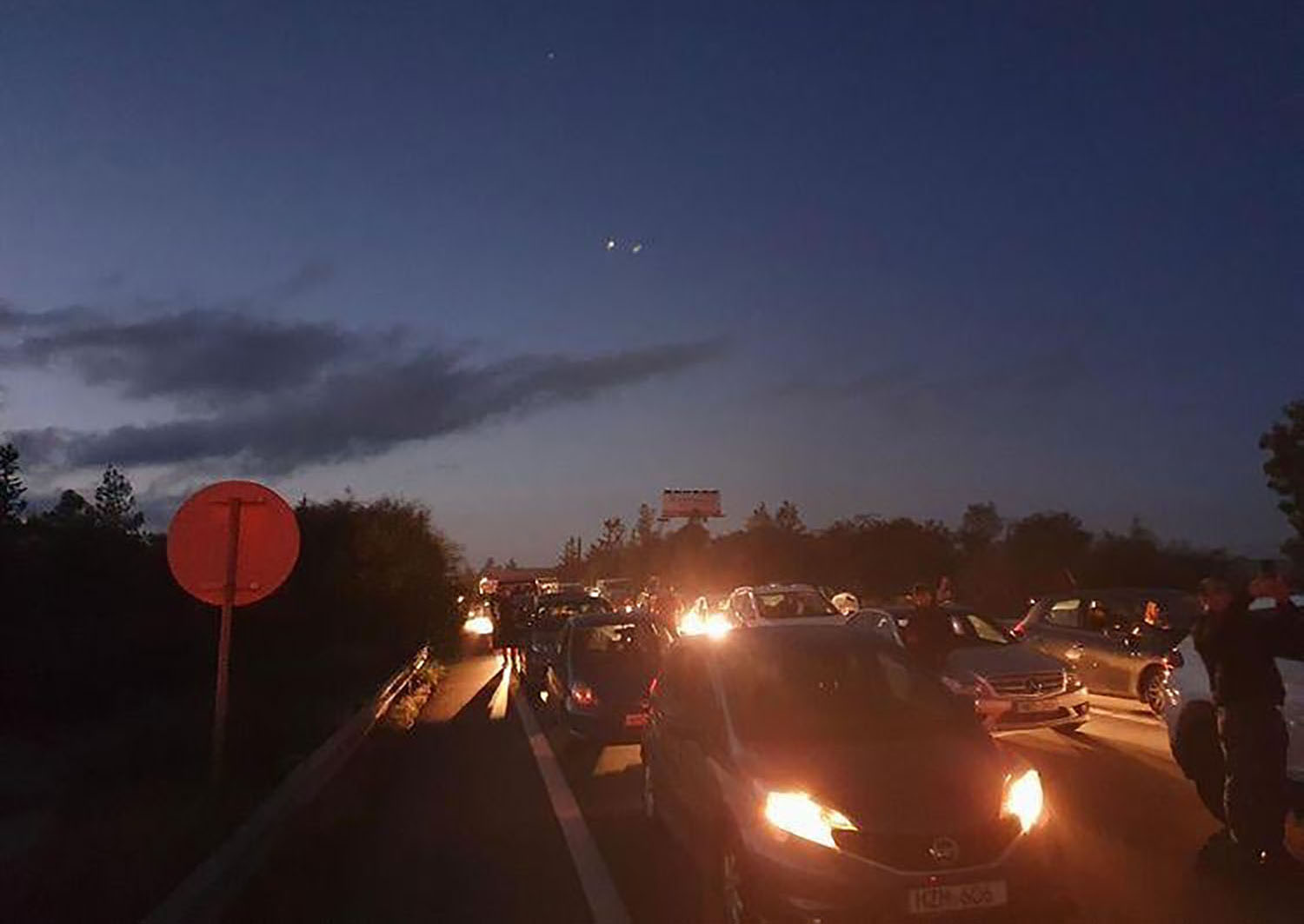 image Police warn of closed roads as parents demonstrate at busy roundabout