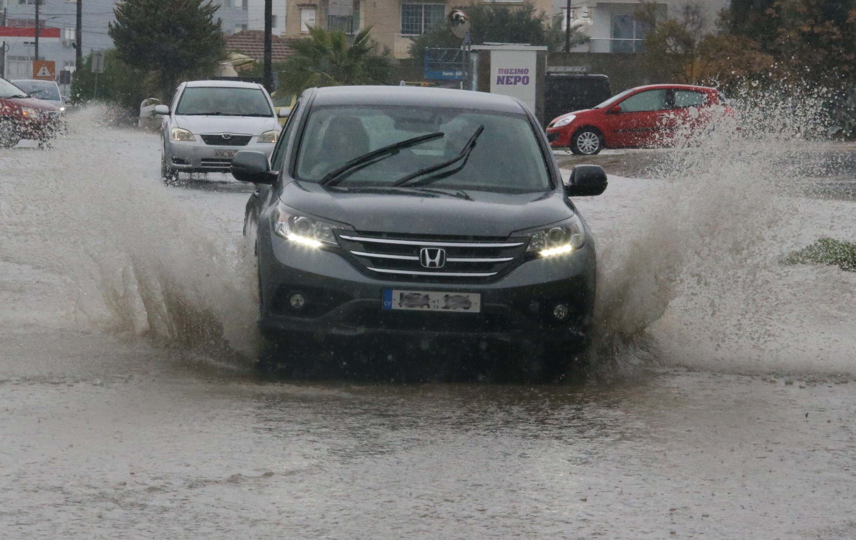 image Torrential rain blocks manholes, cause flooding in Nicosia