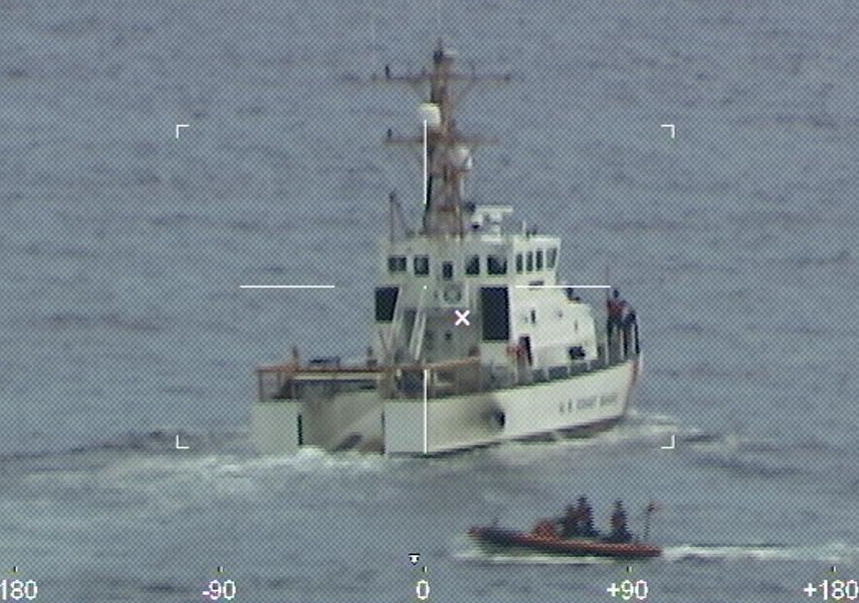 image Teams search through night for 39 missing from capsized boat off Florida