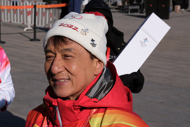 image Actor Jackie Chan carries Olympic torch atop Great Wall