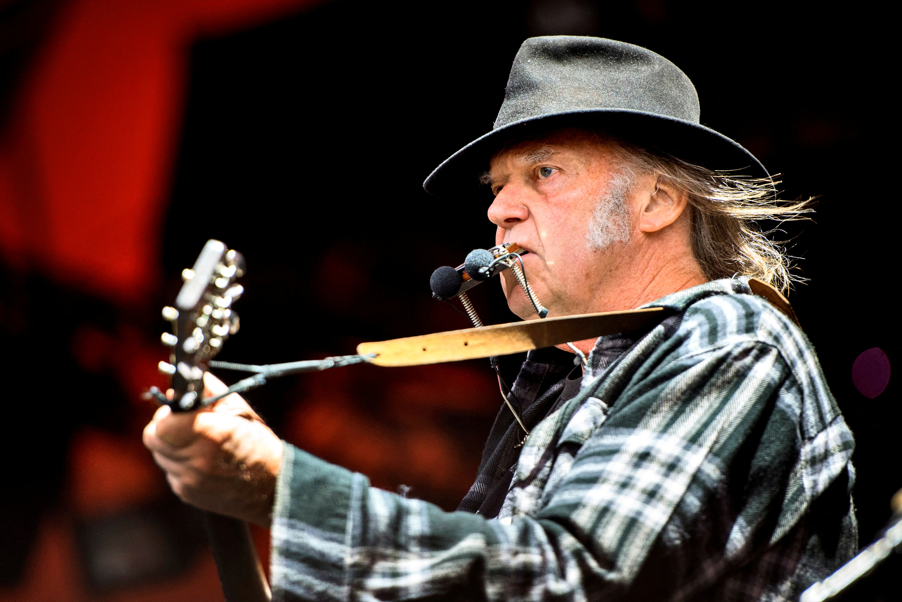 image Neil Young takes aim at Spotify CEO, big banks