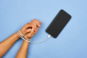 christy prefers the freedom of old technology rather than being tied to her smartphone for work