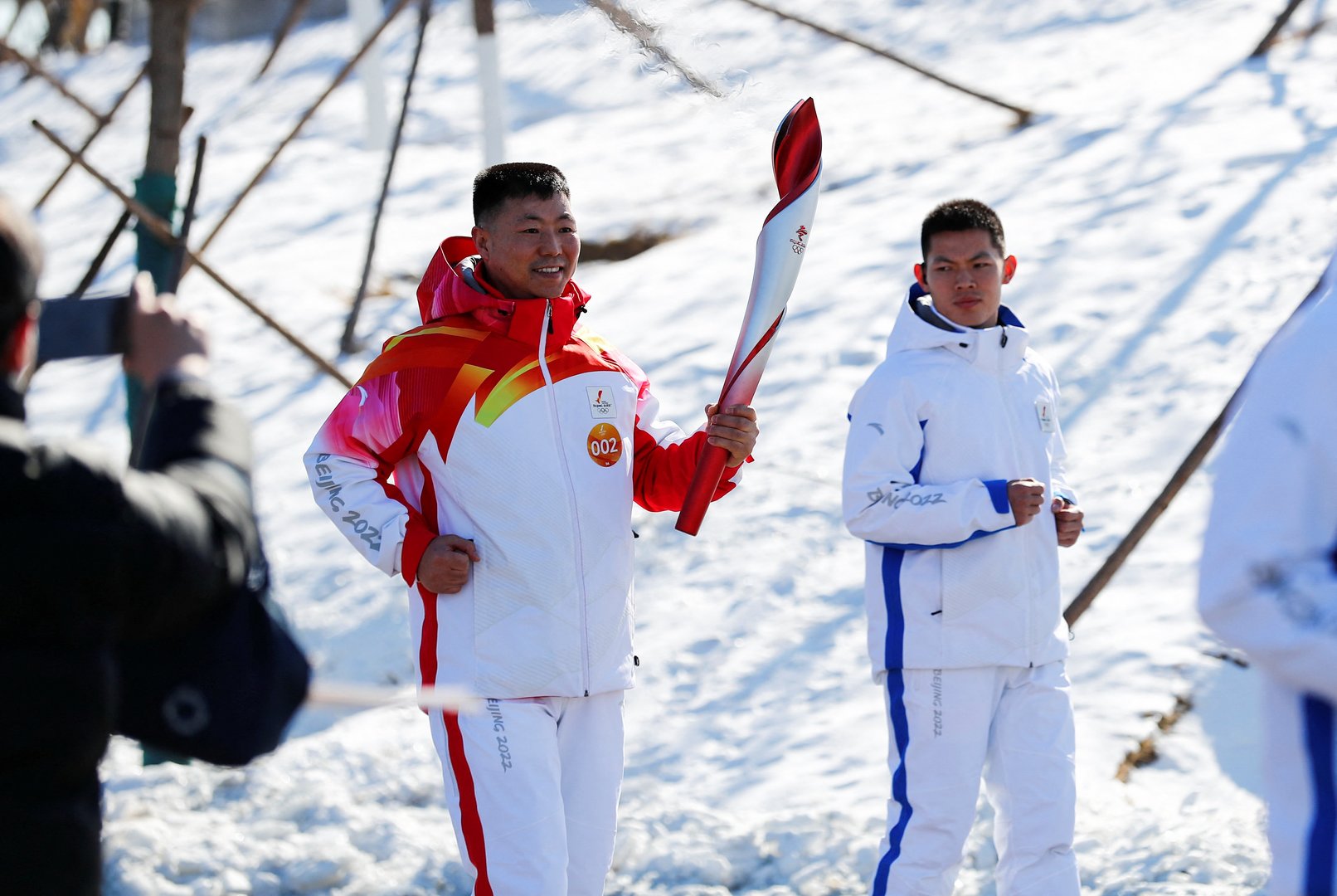 image Beijing torch begins Covid-shortened relay