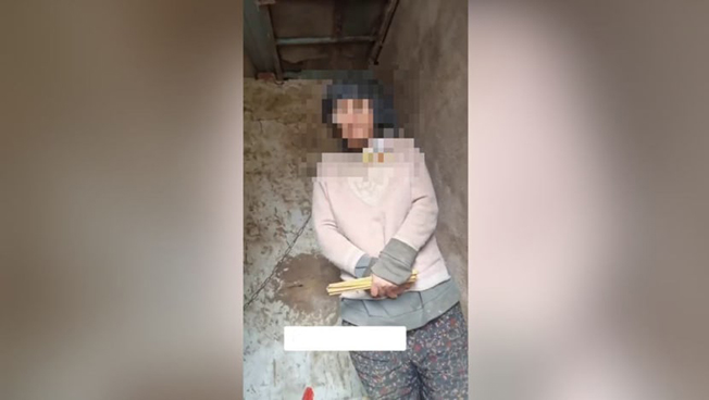 image Dozens in China face punishment over case involving chained woman