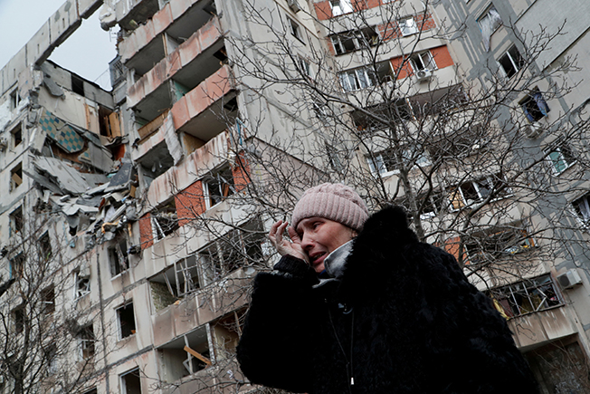 image Dead buildings tower over uncollected corpses in Mariupol