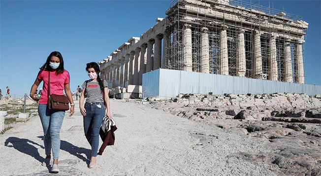 image Greece lifts mask-wearing outdoors as COVID infections recede