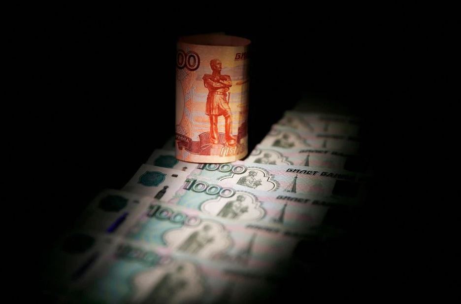 image Russian rouble hits new record low in thin offshore trade