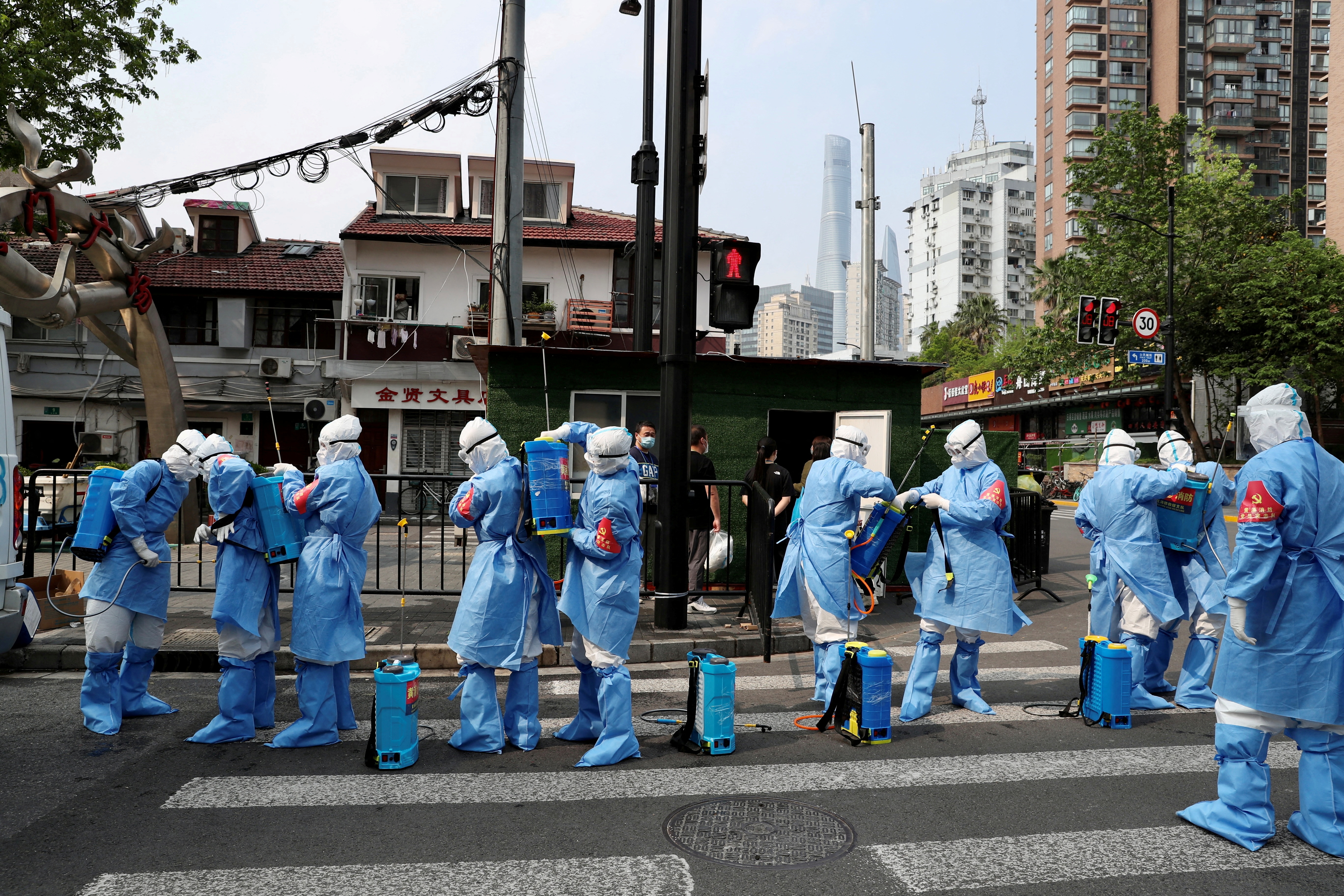image Shanghai fences up Covid-hit buildings, fuelling fresh outcry